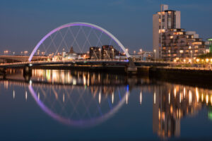 The Clyde Arc and surrounding buildings at night