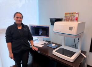 Judith Arroyo of the Badia Hand to Shoulder Center in South Florida takes receipt of the Adaptix Ortho350